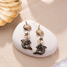 Load image into Gallery viewer, Delightful Dolphin - Gold Shell &amp; Dolphin Fishhook Earrings - Empower Me Pink Exclusive 2025 - Paparazzi Accessories